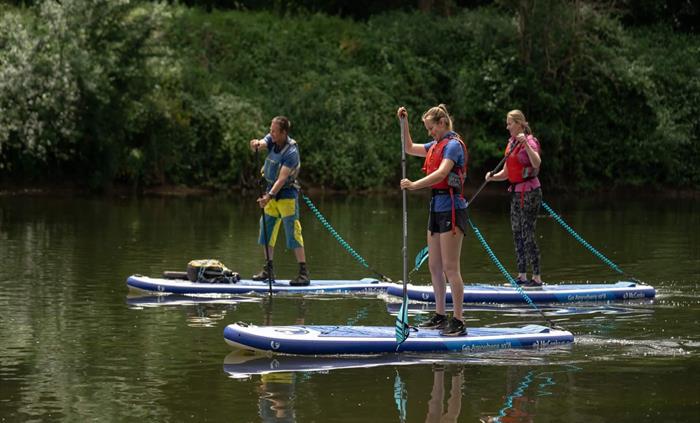 Stand-up paddle boarding on the River Wye best things to do in the Wye Valley at Monmouth Wales and near the Forest of Dean.